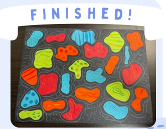Labeled "Finished!" A collage of bright, colorful shapes with various patterns on black cardstock, outlined in white crayon.