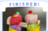 Labeled "Finished!" A photo of two completed tissue paper ice cream cones topped with pom poms, foam stickers, and various cardstock decorations.