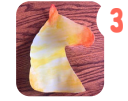 Labeled "three." A cut out of a watercolor painted horse silhouette sits on a wooden table. 