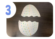 Labeled "three." A colorfully decorated cardstock egg cut in the middle to look like it's cracked.