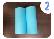 Labeled "two." Two blue paper tubes joined in the middle.