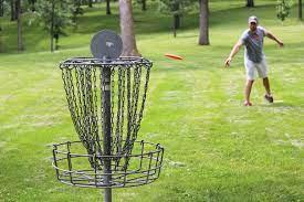 photo of person playing disc golf